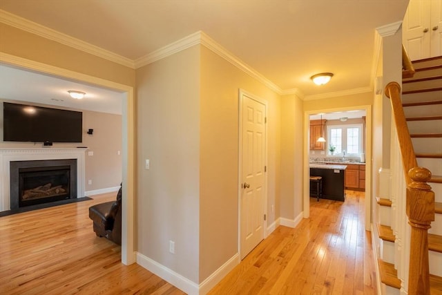 225 Salem Rd, Dracut, MA 01826 - hall featuring light wood finished floors, stairway, ornamental molding, baseboards, and a sink