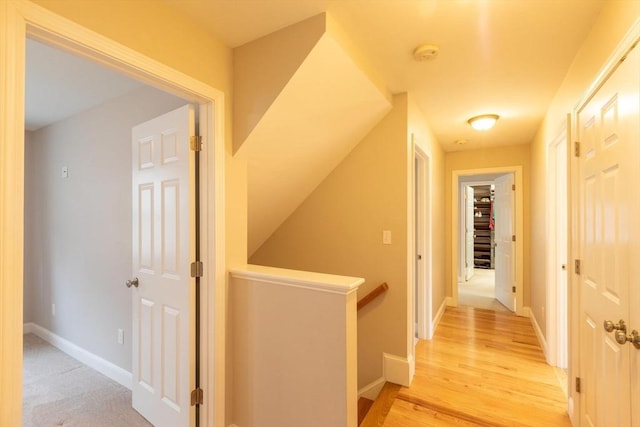 225 Salem Rd, Dracut, MA 01826 - hallway with an upstairs landing, baseboards, and light wood-style flooring