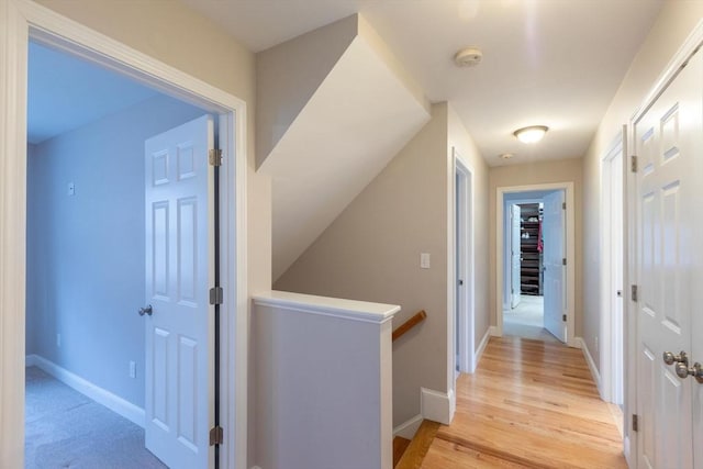 225 Salem Rd, Dracut, MA 01826 - corridor featuring an upstairs landing, baseboards, and light wood finished floors