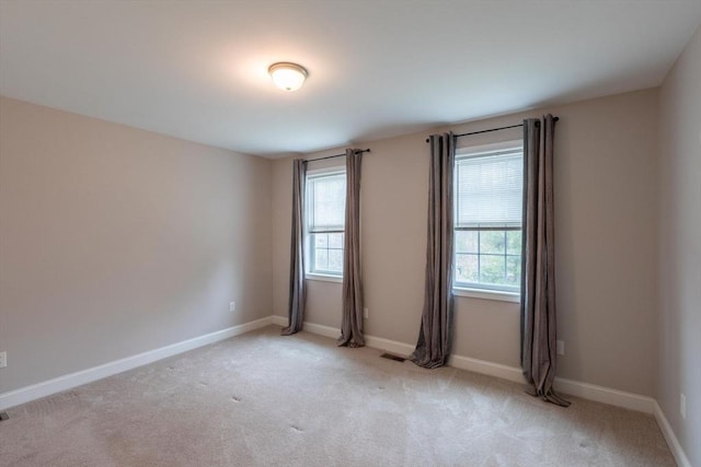 225 Salem Rd, Dracut, MA 01826 - empty room with healthy amount of natural light, light colored carpet, and baseboards