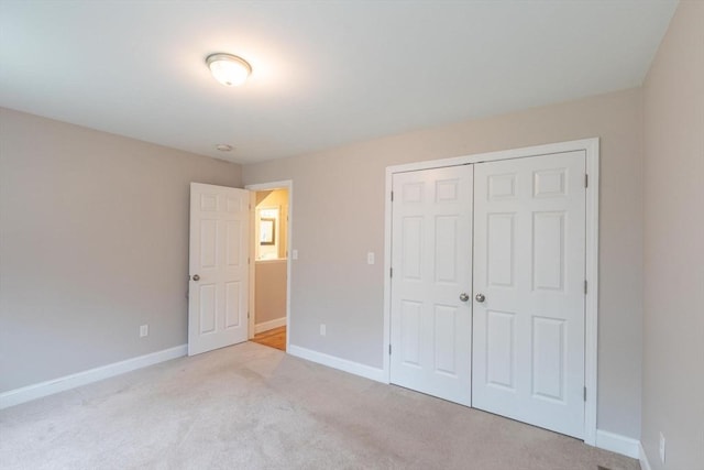 225 Salem Rd, Dracut, MA 01826 - unfurnished bedroom featuring carpet floors, baseboards, and a closet