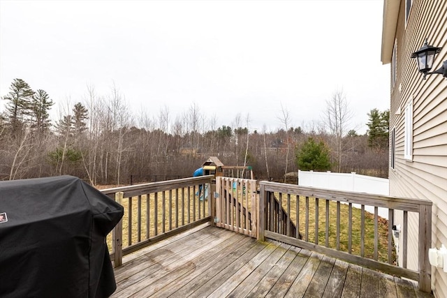 225 Salem Rd, Dracut, MA 01826 - wooden terrace with a grill, a playground, and a wooded view