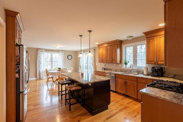 225 Salem Rd, Dracut, MA 01826 - kitchen featuring stainless steel appliances, a sink, brown cabinetry, plenty of natural light, and recessed lighting
