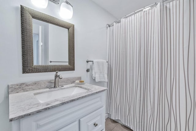 bathroom featuring vanity, a shower with curtain, and tile patterned floors