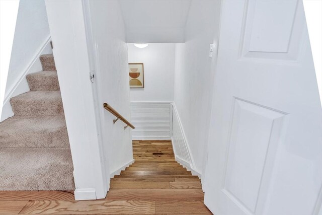 staircase featuring wood finished floors