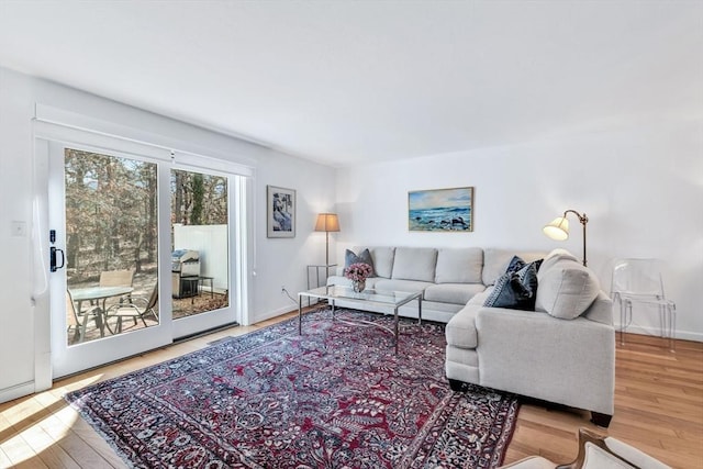 living room with wood finished floors and baseboards