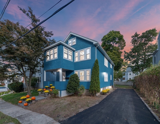 view of front of house with fence