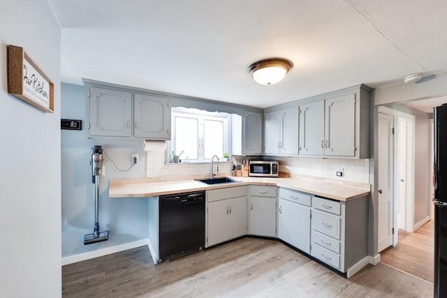 719 College Hwy, Southwick, MA 01077 - kitchen featuring black appliances, a sink, backsplash, and light wood-type flooring