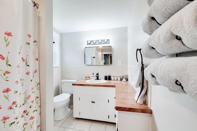 719 College Hwy, Southwick, MA 01077 - full bathroom with tile patterned floors, toilet, vanity, tile walls, and a shower with shower curtain