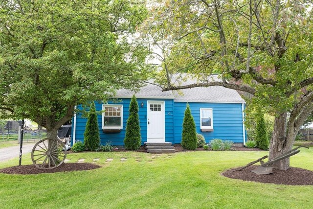 719 College Hwy, Southwick, MA 01077 - view of front of home featuring entry steps, a front yard, and roof with shingles