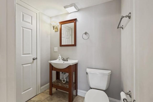 90 Litchfield Unit A, Boston, MA 02135 - half bathroom featuring toilet and baseboards