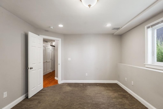 90 Litchfield Unit A, Boston, MA 02135 - unfurnished bedroom with carpet flooring, baseboards, and recessed lighting