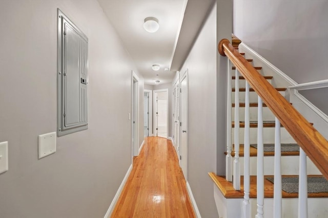 90 Litchfield Unit A, Boston, MA 02135 - corridor with light wood-style flooring, stairway, and baseboards