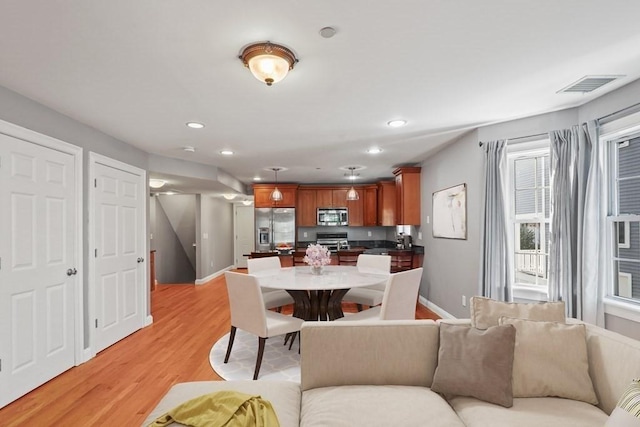 90 Litchfield Unit A, Boston, MA 02135 - dining area with light wood-type flooring, recessed lighting, and baseboards