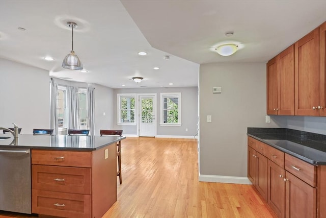 90 Litchfield Unit A, Boston, MA 02135 - kitchen featuring stainless steel dishwasher, recessed lighting, light wood-style flooring, brown cabinets, and baseboards