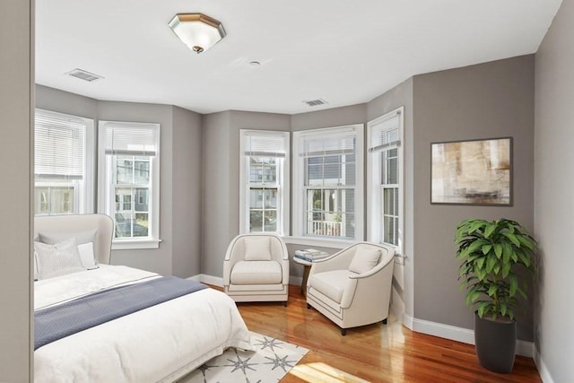 90 Litchfield Unit A, Boston, MA 02135 - bedroom featuring baseboards and wood finished floors