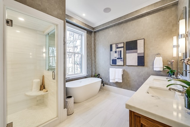 bathroom featuring tile walls, double sink vanity, a bath, tile flooring, and crown molding