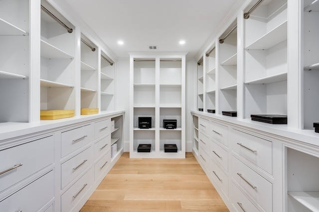 walk in closet featuring light hardwood / wood-style floors