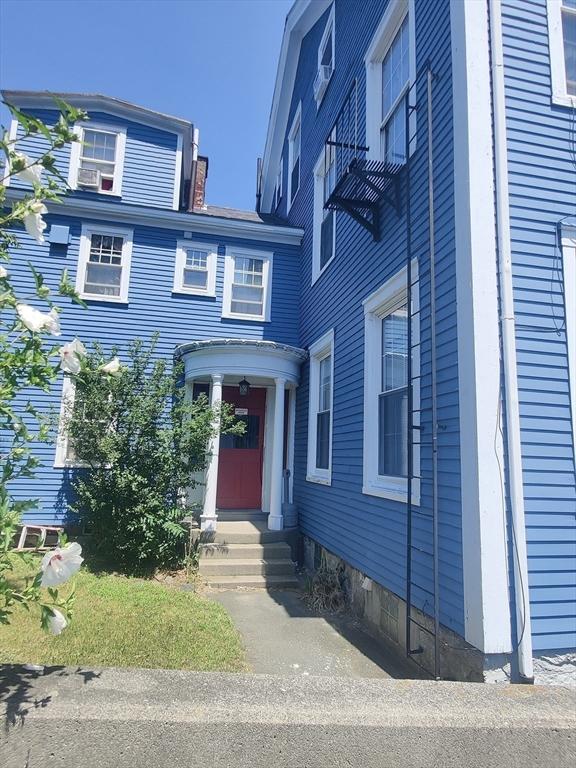 entrance to property with a chimney