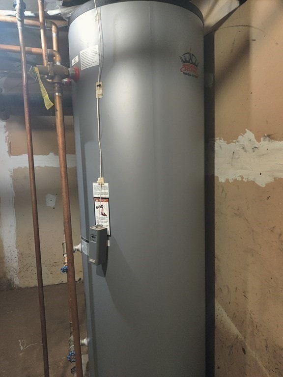 utility room with gas water heater