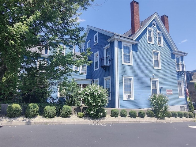 view of home's exterior featuring a chimney