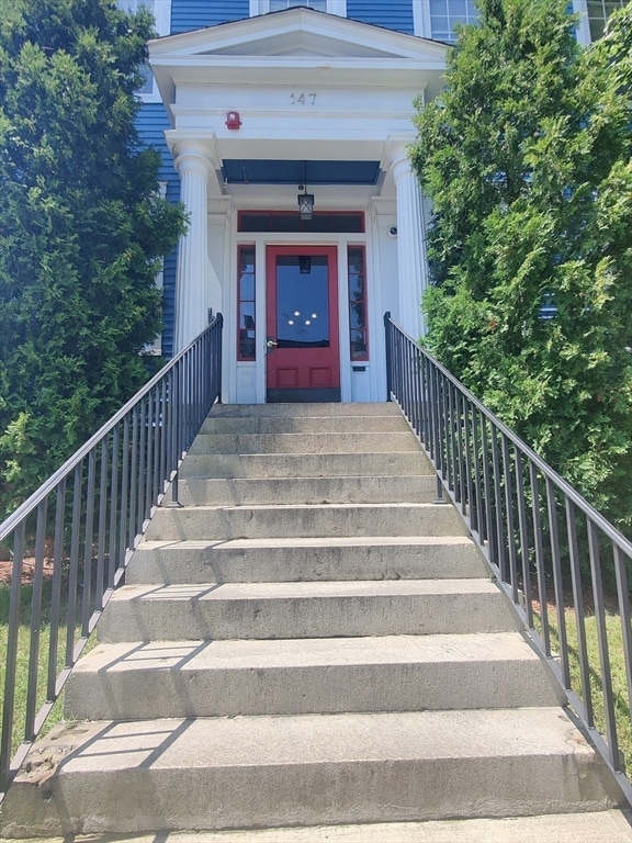 view of exterior entry with covered porch