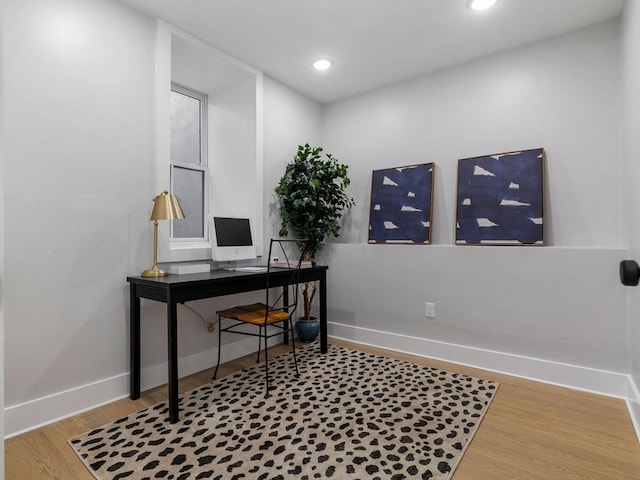 office area with hardwood / wood-style floors