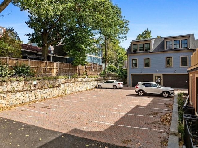 view of parking featuring a garage