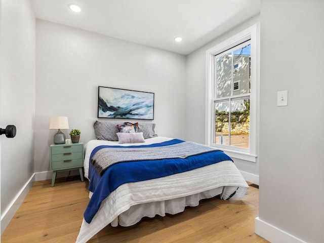 bedroom with wood-type flooring