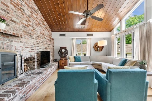 27 Johnson St, Malden, MA 02148 - living room with a brick fireplace, wood ceiling, plenty of natural light, lofted ceiling, and wood finished floors