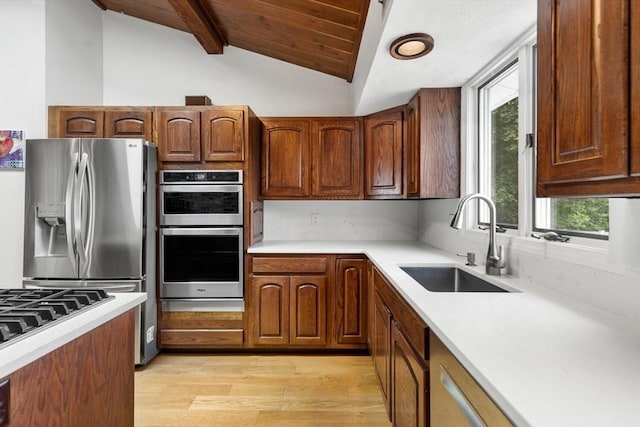 27 Johnson St, Malden, MA 02148 - kitchen with plenty of natural light, stainless steel appliances, light wood-style floors, light countertops, and wooden ceiling