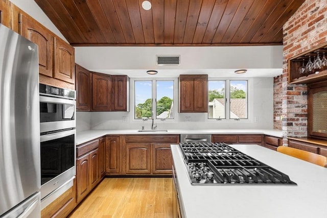 27 Johnson St, Malden, MA 02148 - kitchen featuring stainless steel appliances, light countertops, light wood-style flooring, and wooden ceiling