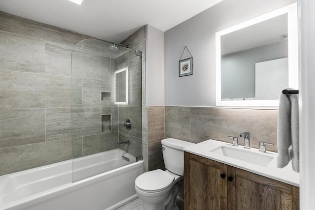 27 Johnson St, Malden, MA 02148 - bathroom with shower / washtub combination, vanity, and tile walls
