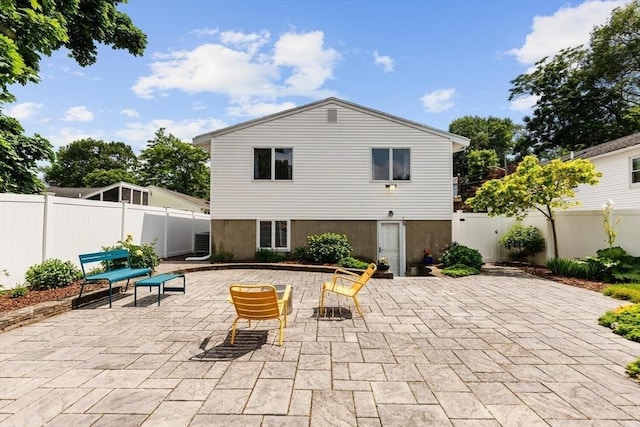 27 Johnson St, Malden, MA 02148 - rear view of property with a patio and a fenced backyard