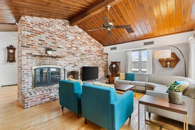 27 Johnson St, Malden, MA 02148 - living area with wood ceiling, a brick fireplace, wood finished floors, and a ceiling fan