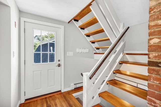 2 Clover Hill Rd, Acton, MA 01720 - entryway with wood finished floors, stairway, and a baseboard radiator