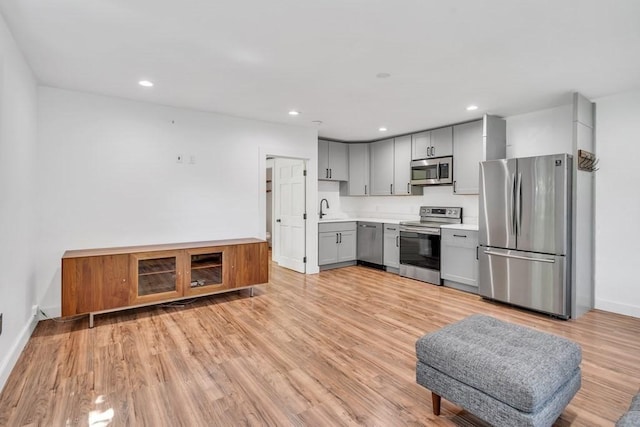2 Clover Hill Rd, Acton, MA 01720 - kitchen with stainless steel appliances, gray cabinetry, light countertops, light wood finished floors, and recessed lighting