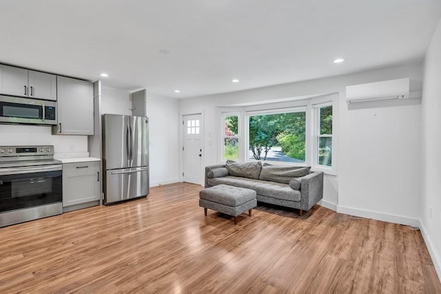 2 Clover Hill Rd, Acton, MA 01720 - living area featuring a wall mounted AC, light wood-style floors, and recessed lighting