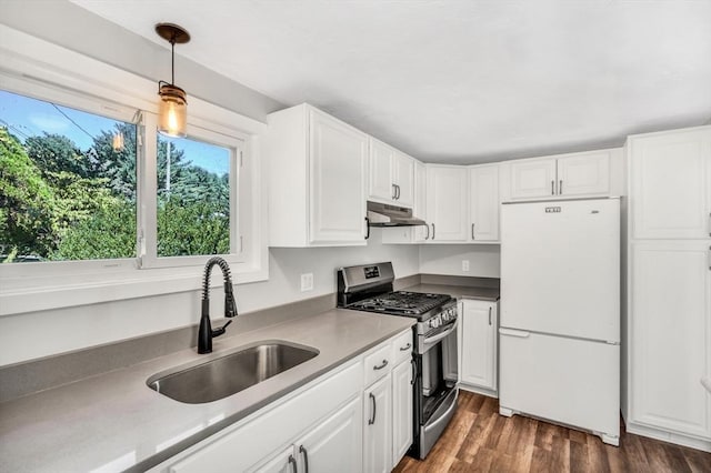 2 Clover Hill Rd, Acton, MA 01720 - kitchen featuring freestanding refrigerator, gas stove, under cabinet range hood, and white cabinets