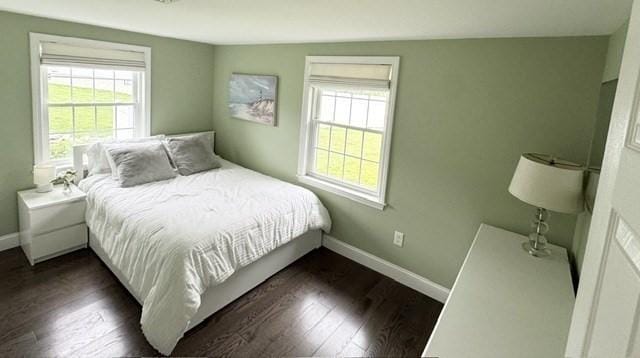 214 Fisher St, Walpole, MA 02081 - bedroom with multiple windows and dark wood-style floors