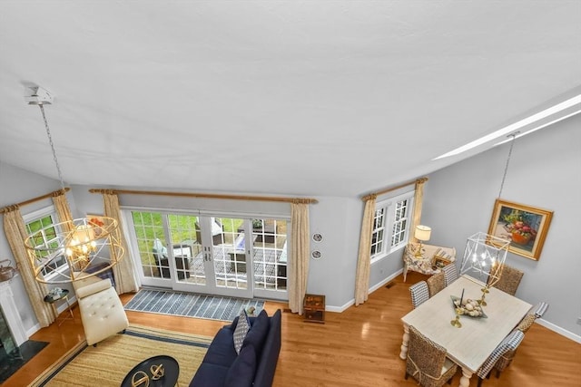 10 Highcroft Way Unit 10, Hopkinton, MA 01748 - living room featuring wood finished floors, baseboards, lofted ceiling, and french doors