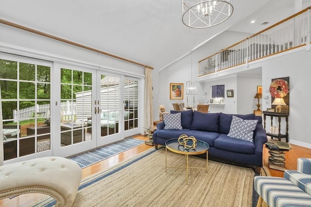 10 Highcroft Way Unit 10, Hopkinton, MA 01748 - living area with wood finished floors, high vaulted ceiling, a chandelier, and baseboards