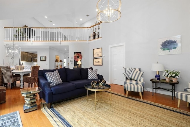 10 Highcroft Way Unit 10, Hopkinton, MA 01748 - living area with a chandelier, wood finished floors, a high ceiling, and recessed lighting