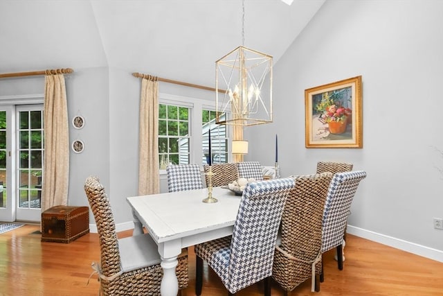 10 Highcroft Way Unit 10, Hopkinton, MA 01748 - dining area featuring a chandelier, lofted ceiling, baseboards, and wood finished floors