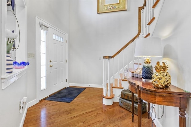 10 Highcroft Way Unit 10, Hopkinton, MA 01748 - foyer with stairway, wood finished floors, baseboards, and a towering ceiling
