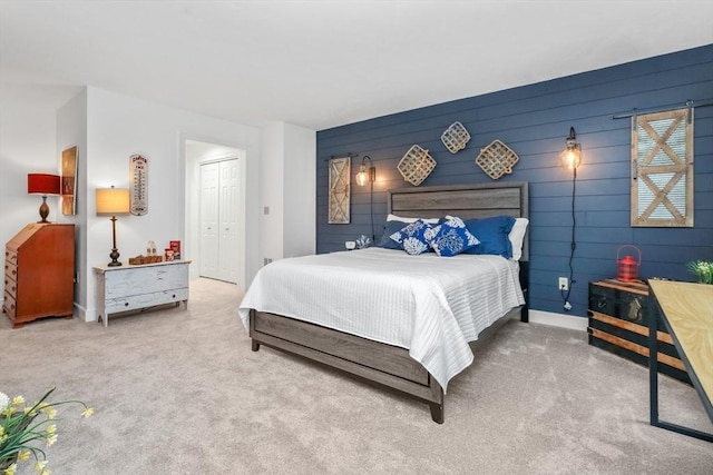 10 Highcroft Way Unit 10, Hopkinton, MA 01748 - bedroom featuring carpet, a closet, baseboards, and wooden walls