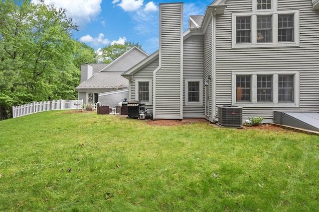10 Highcroft Way Unit 10, Hopkinton, MA 01748 - rear view of house with central AC unit and a chimney