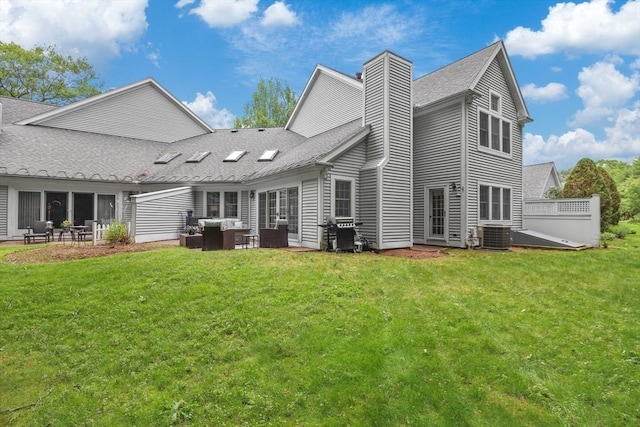 10 Highcroft Way Unit 10, Hopkinton, MA 01748 - back of property with a lawn, a chimney, and a patio