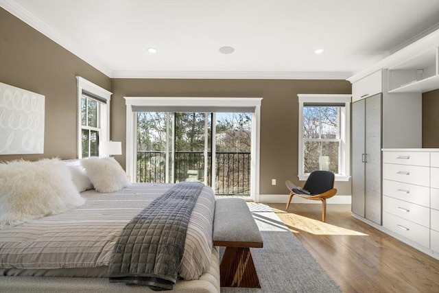 bedroom featuring wood finished floors, baseboards, recessed lighting, ornamental molding, and access to outside