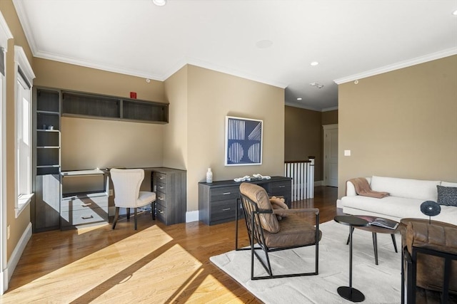 living area with crown molding, recessed lighting, light wood-style floors, and baseboards